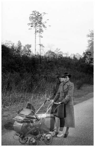 A black and white archival photograph features a woman pushing a pram. A double exposure effect overlays another image of a woman in modern attire also pushing a pram.