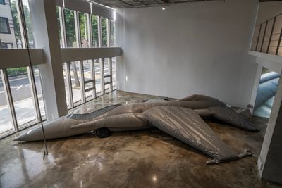 A decoy military aircraft lies deflated on the gallery floor, in Fiona Banner's exhibition at Barakat Contemporary in Seoul.