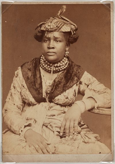 Unknown, Martinique Woman (c. 1890). Albumen print. Overall: 14.6 x 10.2 cm. Montgomery Collection of Caribbean Photographs. Purchase, with funds from Dr. Liza & Dr. Frederick Murrell, Bruce Croxon & Debra Thier, Wes Hall & Kingsdale Advisors, Cindy & Shon Barnett, Donette Chin-Loy Chang, Kamala-Jean Gopie, Phil Lind & Ellen Roland, Martin Doc McKinney, Francilla Charles, Ray & Georgina Williams, Thaine & Bianca Carter, Charmaine Crooks, Nathaniel Crooks, Andrew Garrett & Dr. Belinda Longe, Neil L. Le Grand, Michael Lewis, Dr. Kenneth Montague & Sarah Aranha, Lenny & Julia Mortimore, and The Ferrotype Collective, 2019. © Art Gallery of Ontario 2019/2208