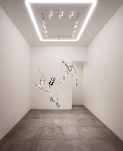 White sculpture of organic matter floating in the middle of gallery space by artist Hyungkoo Lee