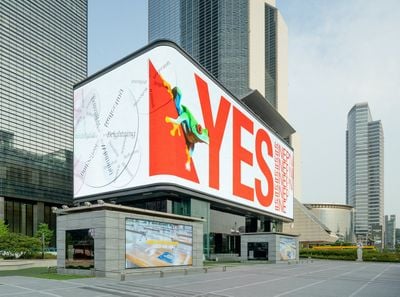 Big billboard sized poster showing the word YES in red text against a white background at the K-Pop Square in Seoul