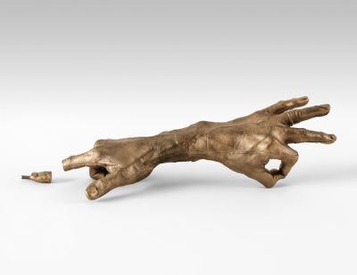 A silicon bronze sculpture of a pair of hands joined together at the wrists with one finger severed by artist Bruce Nauman, entitled Hand Pair (1996)