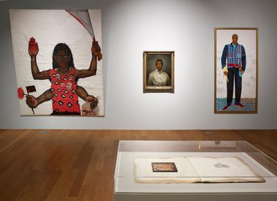Painting of dark-skinned woman with her tongue out brandishing a machete besides two portraits of Black men.
