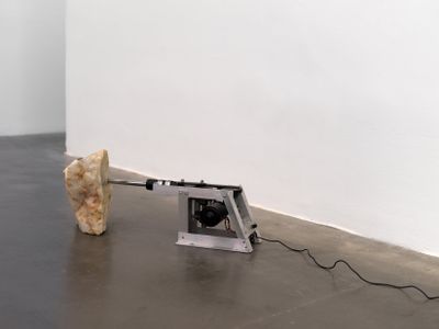 Stone attached to drill installation placed on gallery floor