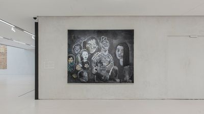 A painting by Yu Youhan with different figures outlined in white against a black background, hanging against a creme wall in the gallery space.