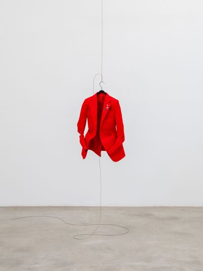 Chung Seoyoung, Red (2024). Textile, badge, stainless steel wire, hanger. 47 x 25 x 63 cm.