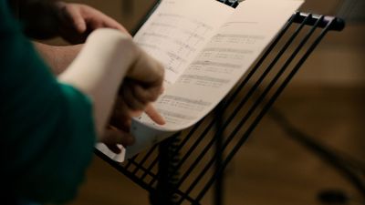 Holly Herndon and Mat Dryhurst conducting a recording session with London Contemporary Voices in London, 2024.