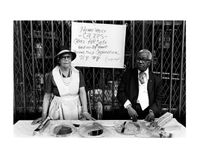 A Man and Woman at an Outdoor Bake Sale, Harlem, NY by Dawoud Bey contemporary artwork sculpture, photography