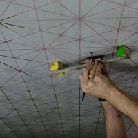 Richard Wright installing his gold-leaf work on the concrete ceiling of the Tottenham Court Road station for London’s new Elizabeth railway line. Commissioned in 2018 for the Crossrail Art Programme by Richard Wright contemporary artwork installation