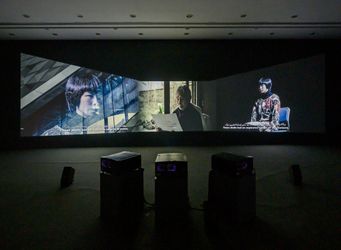 Meiro Koizumi, The Angels of Testimony (2019). Three-channel video installation, colour, sound, archival material. Duration and dimensions variable. Commissioned by Sharjah Art Foundation. Exhibition view: Sharjah Biennial 14: Leaving the Echo Chamber (7 March–10 June 2019). Courtesy Sharjah Art Foundation.Image from:Sharjah Biennial 14: Leaving the Echo ChamberRead FeatureFollow ArtistEnquire
