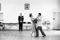 Dancing-master, Ted van Rensburg, watches two of his ballroom pupils swinging to a recording of Victor Sylvester and his Orchestra, in the MOTHS’ Hall at the old Court House by David Goldblatt contemporary artwork photography