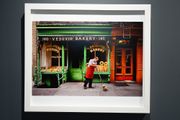 A man sweeps outside a bakery, New York, NY, USA by Steve McCurry contemporary artwork 2