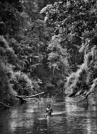 Young Hatiri bathes in a backwater of the Pretão stream, Suruwahá Indigenous Territory, state of Amazonas, Brazil by Sebastião Salgado contemporary artwork photography