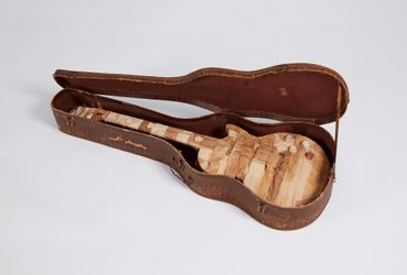 Nell, From Memphis to Memphis (2021). 1950s Gibson Alligator Guitar Case, Vintage Gibson Les Paul Junior Guitar, archival PVA, cotton, linen, plastic, gold, steel, brass, aluminium, paintbrush. 46 x 105.3 x 48.5 cm. Courtesy the artist and STATION, Melbourne and Sydney. Photo: Jenni Carter.Image from:Nell: 'I'm always thinking about how a painting might sound'Read ConversationFollow ArtistEnquire
