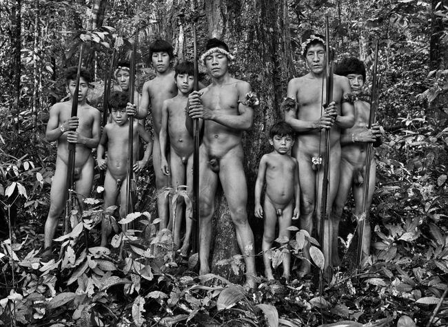 Awa travel through the forest searching for signs of invaders and loggers, Awá-Guajá Indigenous Territory, state of Maranhão, Brazil, 2013 by Sebastião Salgado contemporary artwork