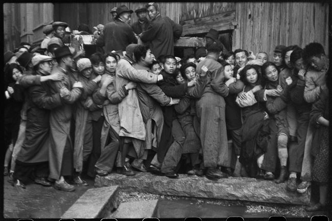 At the end of the day, people wait in line hoping to buy gold. Shanghai, 23 December 1948 by Henri Cartier-Bresson contemporary artwork