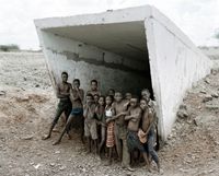 Children of Pomfret at the entrance to the incline shaft and underground pool of water in which they swim, Pomfret Blue Asbestos Mine, which closed in 1986, North-West Province, 20 December 2002 by David Goldblatt contemporary artwork print