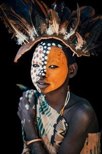 Suri Girl in Feather Headress, Omo Valey, Ethiopia by Andrew Eldon contemporary artwork photography, print