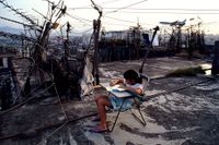Student Doing Homework on Walled City Rooftop by Greg Girard contemporary artwork photography, print