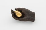 Boy holding scarab beetle by Dorothy Cross contemporary artwork sculpture