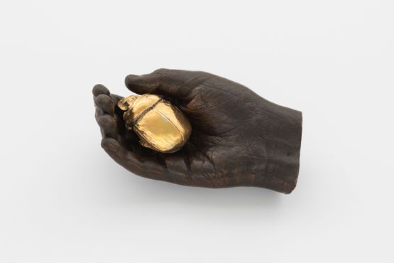 Boy holding scarab beetle by Dorothy Cross contemporary artwork Sculpture