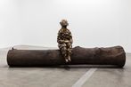 Bumpman on a tree trunk by Paloma Varga Weisz contemporary artwork Sculpture