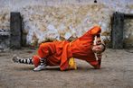 Young monk practicing Shaolin one of the oldest styles of Kung Fu Shaolin Monastery Henan Province China by Steve Mccurry contemporary artwork Photography