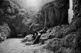 A tuna fisherman asleep on a net Trapani Sicily Italy by Sebastiao Salgado contemporary artwork photography