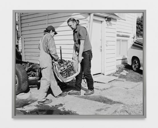 Men move an engine block by Jeff Wall contemporary artwork Sculpture