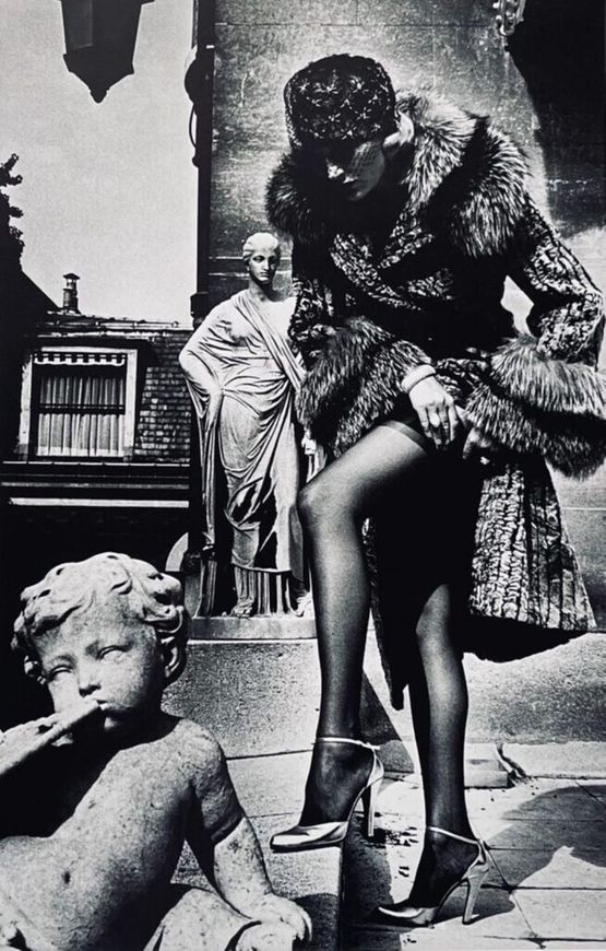 Woman in Coat Adjusting Stocking Paris 1975 by Helmut Newton contemporary artwork Print