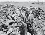 Luke Kgatitsoe in his house bulldozed in February 1984 by the government after the forced removal of the people of Magopa a black-owned farm which had been declared a black spot Ventersdorp district Transvaal. 21 October 1986 4_4588 by David Goldblatt contemporary artwork photography print
