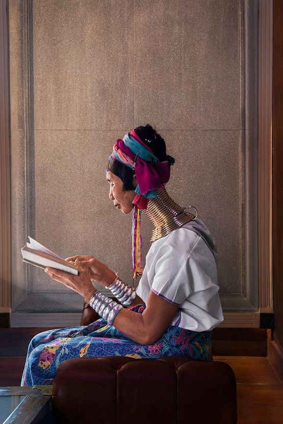 A woman reads in the light coming through the window Chiang Mai Thailand by Steve Mccurry contemporary artwork Photography