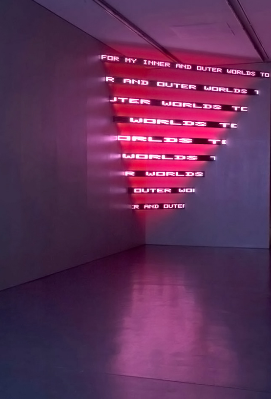 Looming Text Gravity and Center Bowl of Lilacs Poppies and the lost bee by Henri Cole by Jenny Holzer contemporary artwork Sculpture