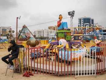 Bacem Smoking at a Port of Sfax Carnival Tunisia by Lucas Foglia contemporary artwork print