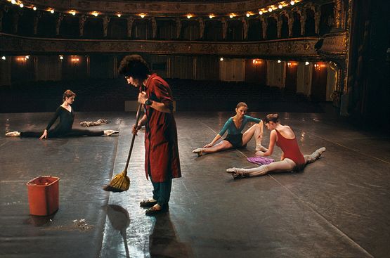 Man sweeps on stage while ballerinas stretch National Ballet Zagreb Croatia by Steve Mccurry contemporary artwork Photography