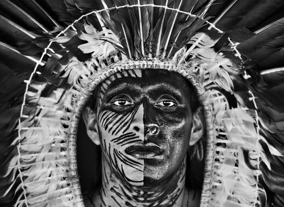 Adao Yawanawa in a headdress of eagle feathers village of Nova Esperanca Rio Gregorio Indigenous Territory state of Acre Brazil by Sebastiao Salgado contemporary artwork Photography