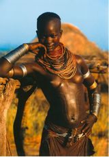 Karo girl with patterned stomach by Carol Beckwith  Angela Fisher contemporary artwork photography