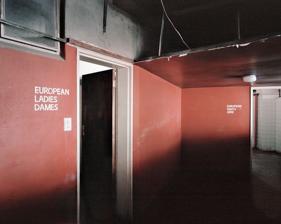 Apartheid-era bathroom signs Ponte City 0976 by Mikhael Subotzky and Patrick Waterhouse contemporary artwork Photography