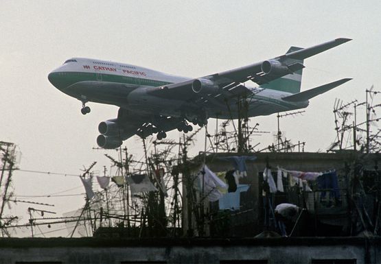 cathay-pacific-jet-above-the-kowloon-walled-city-1998-by-greg-girard