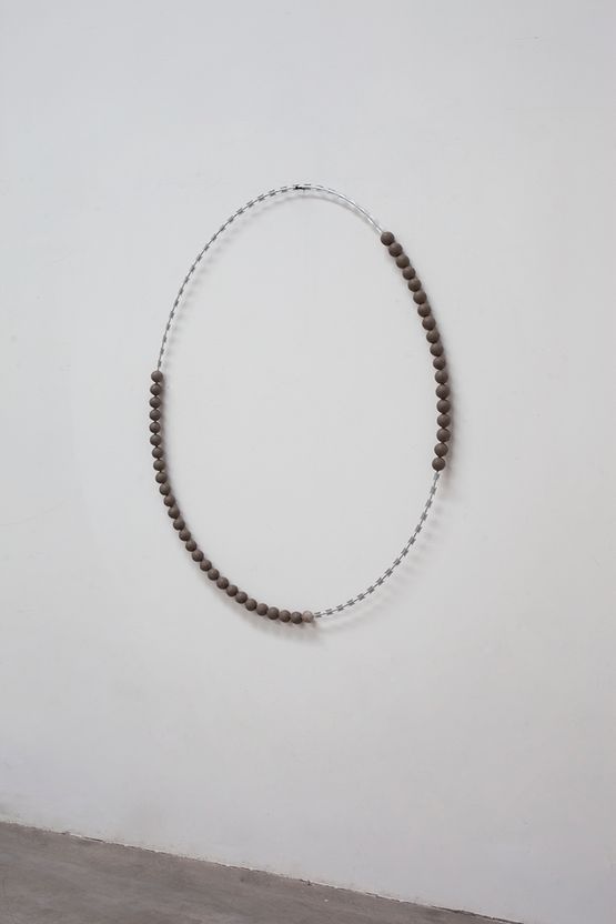 Isolation net wrapped with mud balls by Zhou Wendou contemporary artwork Sculpture