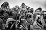 Land of a Thousand Struggles Women workers huddling together to mark their attendance at an MGNREGA worksite in Pati Madhya Pradesh by Sohrab Hura contemporary artwork Photography