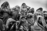 Land of a Thousand Struggles Women workers huddling together to mark their attendance at an MGNREGA worksite in Pati Madhya Pradesh by Sohrab Hura contemporary artwork photography