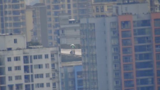 Telephoto Videographer by Yu Guo contemporary artwork Moving Image