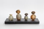 Lineup Eight Pebbles by Francis Upritchard contemporary artwork Sculpture