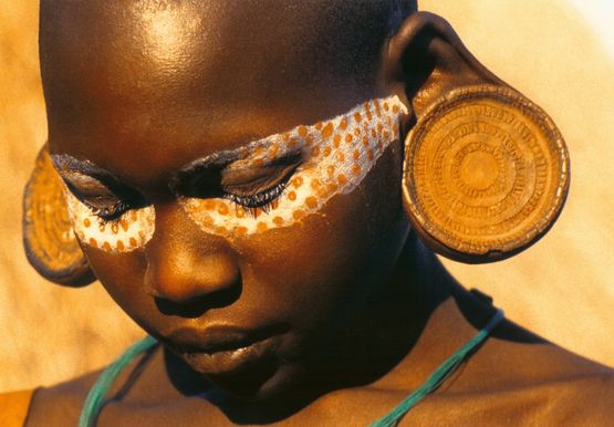 Surma woman with painted eye-mask by Carol Beckwith  Angela Fisher contemporary artwork Photography