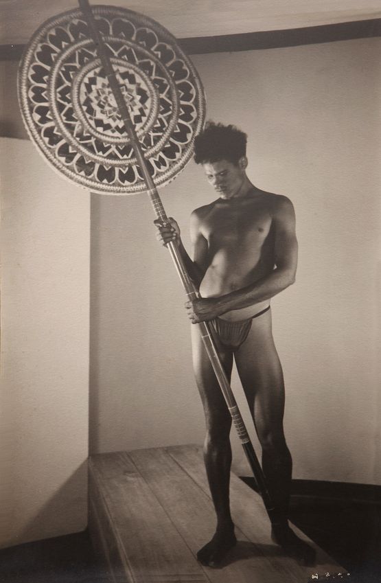 Man holding a sestha by Lionel Wendt contemporary artwork Print