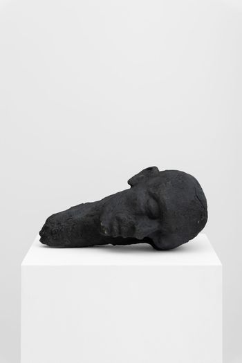 Sleeping bronze head by Ali Cherri contemporary artwork sculpture