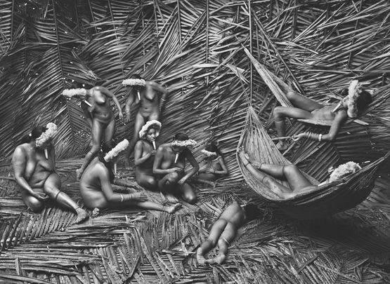 Women in the Zoe village of Towari Ypy color their bodies with the red fruit of theurucum. Para Brazil. by Sebastiao Salgado contemporary artwork Photography