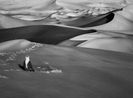 Man Praying in the Sand Dunes in Maor Tadrart South of Djanet Algeria by Sebastiao Salgado contemporary artwork Print
