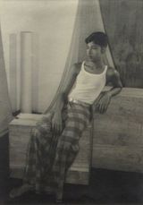 Male seated on the wooden block by Lionel Wendt contemporary artwork photography